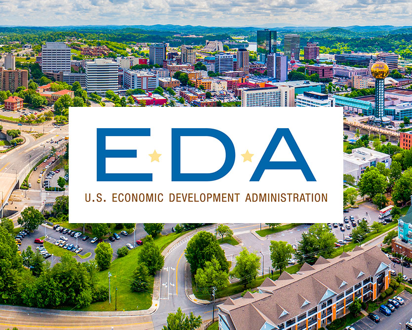 Economic Development Association University Center logo over the Knoxville skyline